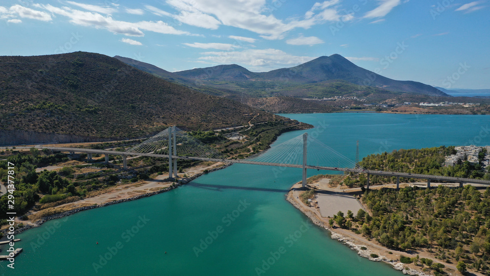 Aerial drone photo of famous new suspension bridge of halkida or Chalkida connecting mainland Greece with Evia island with beautiful clouds and blue sky, Greece Aerial drone photo of famous new suspension bridge of halkida or Chalkida connecting mainland Greece with Evia island with beautiful clouds and blue sky, Greece