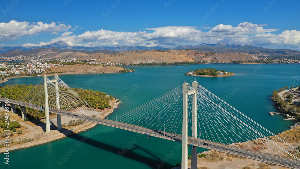 Aerial drone photo of marvel of Engineering suspension bridge connecting mainland with island over deep blue sea