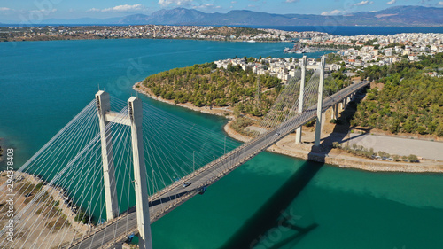 Aerial drone photo of famous new suspension bridge of halkida or Chalkida connecting mainland Greece with Evia island with beautiful clouds and blue sky, Greece