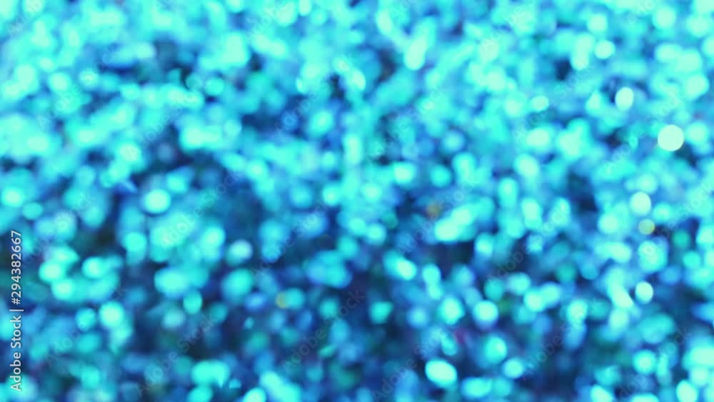 New Year's blue sparkles - the image goes from sharp to defocus, a beautiful, spectacular bokeh appears. Abstract bright holiday video. Copyspace New Year's blue sparkles - the image goes from sharp to defocus, a beautiful, spectacular bokeh appears. Abstract bright holiday video. Copyspace