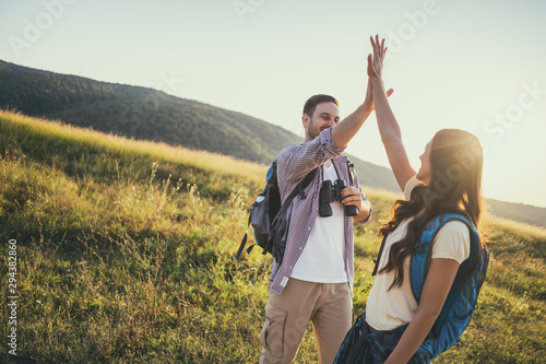Photography Happy couple is hiking in mountain. They are excited.