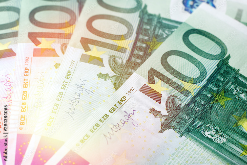 Closeup of a few paper notes in denominations of 100 euros Closeup of a few paper notes in denominations of 100 euros