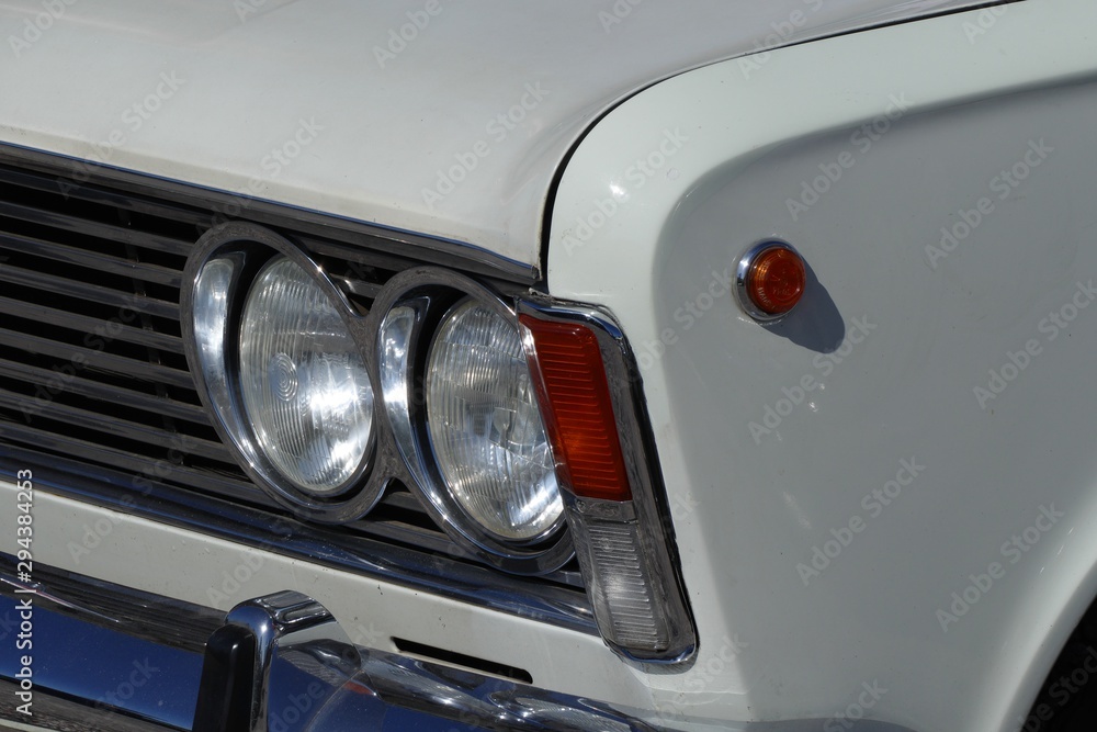 classic car headlamp and grill detail