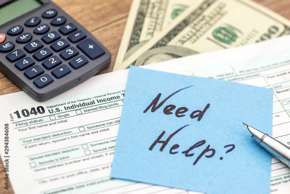 Tax form, calculator and dollar on wooden background Tax form, calculator and dollar on wooden background