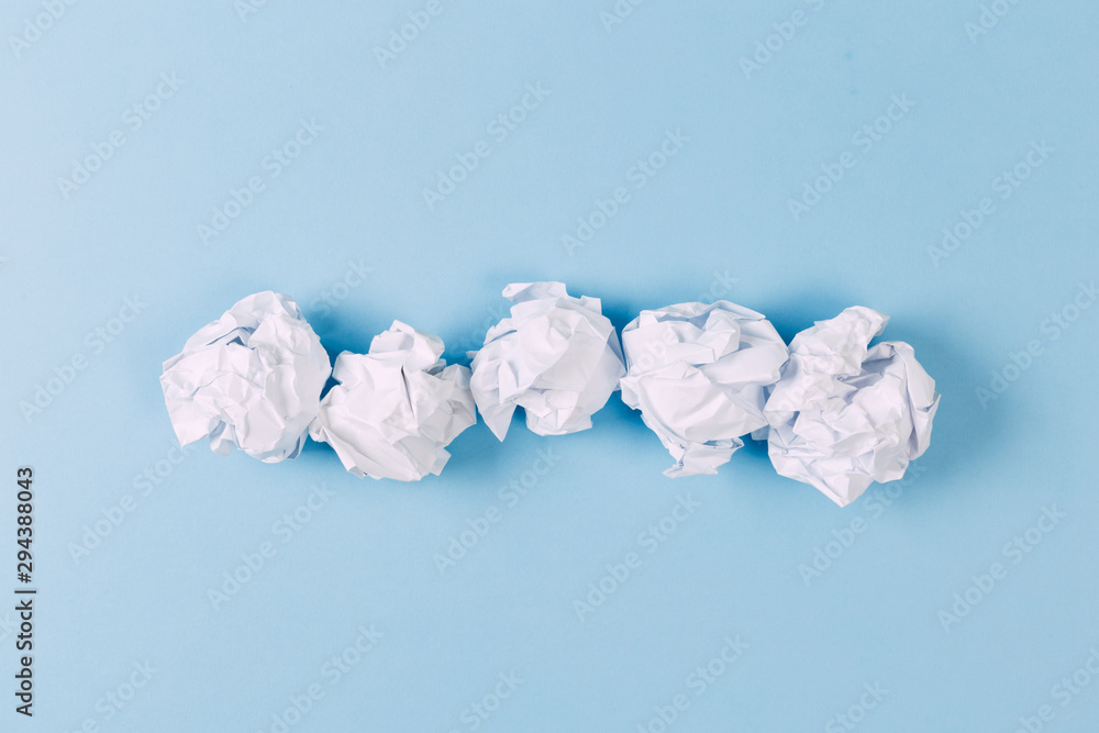 Close-up of Crumble paper isolated on blue background Close-up of Crumble paper isolated on blue background