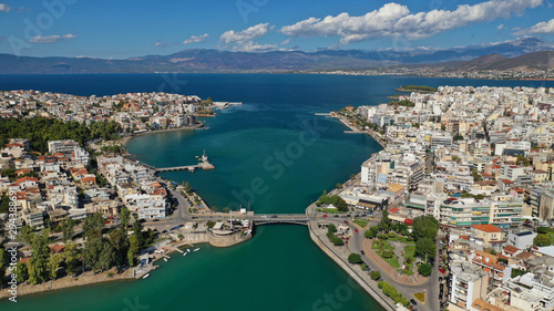 Aerial top view photo of famous old steel bridge of Halkida or Chalkida connecting mainland with Evia island, Greece