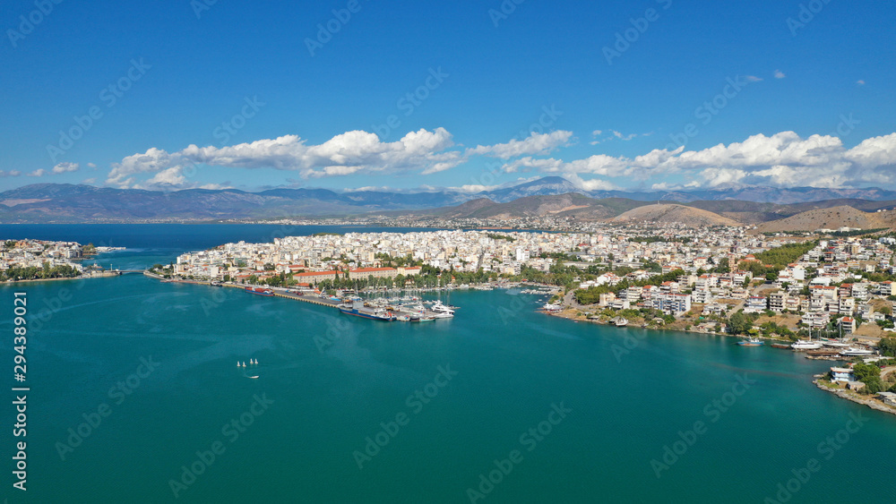 Aerial photo of famous seaside town of Halkida with beautiful clouds and deep blue sky, Evia island, Greece