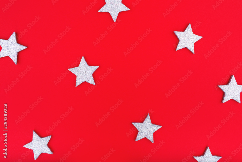 Pattern stars on red background. Christmas or New Year decoration background. Flat lay, copy space, top view. Merry Christmas s card.