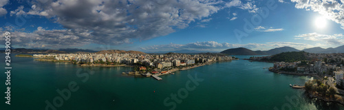 Fototapeta Naklejka Na Ścianę i Meble -  Aerial drone photo of famous seaside town of Halkida or Chalkida with beautiful clouds and deep blue sky featuring old bridge connecting Evia island with mainland Greece