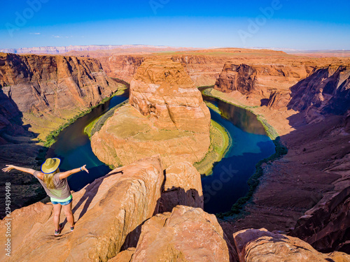 Sexy girl admires panorama of Horseshoe Bend, Page Arizona, The Colorado River