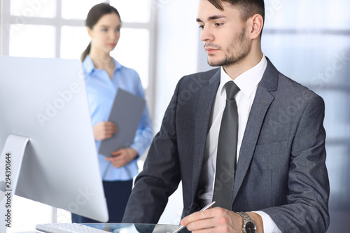 Wallpaper Mural Businessman working with computer in modern office. Headshot of arab male entrepreneur or manager at workplace. Business concept Torontodigital.ca