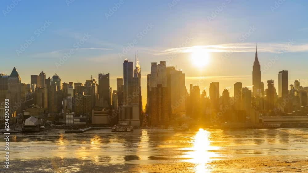 Midtown Manhattan skyline at sunrise in New York, timelapse of rising sun