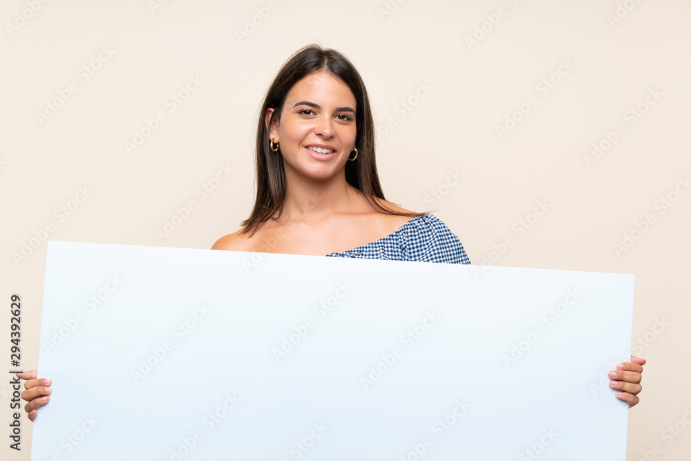 Young girl over isolated background holding an empty white placard for insert a concept Young girl over isolated background holding an empty white placard for insert a concept