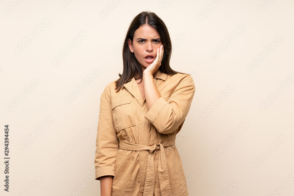Young girl over isolated background surprised and shocked while looking right Young girl over isolated background surprised and shocked while looking right