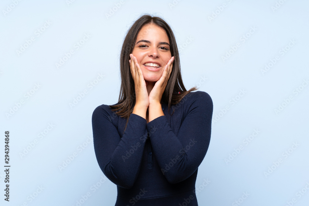 Young girl over isolated blue background with surprise facial expression Young girl over isolated blue background with surprise facial expression