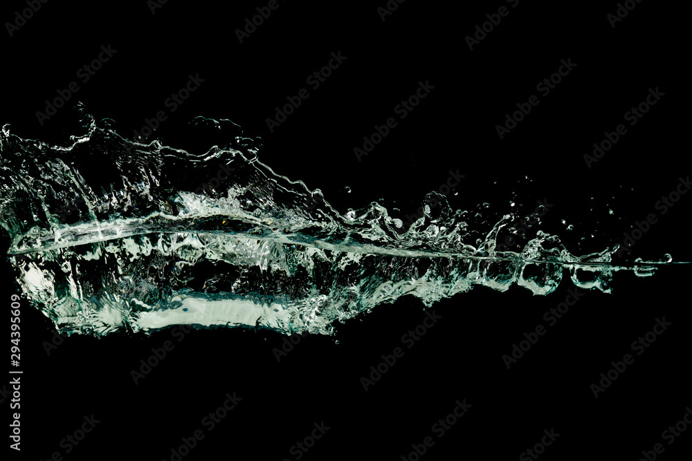 Obraz premium Water wave splash isolated black background.