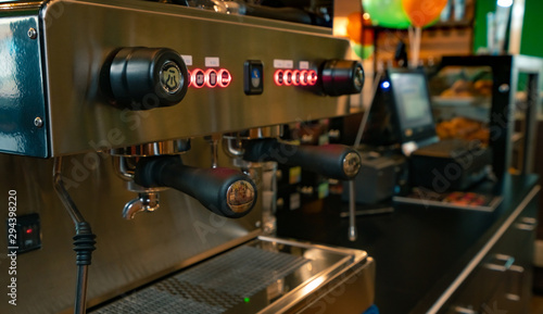 Close up professional coffee machine in coffee shop. Coffee maker for make espresso  americano  latte  and cappuccino. Counter bar of coffee shop. Modern tool for barista. Beverage service business.