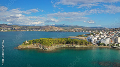 Aerial drone photo of iconic lighthouse built in small islet in famous city of Halkida or Chalkida with clear water seascape and beautiful sky - clouds  Evia island  Greece