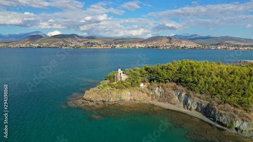 Aerial drone photo of iconic lighthouse built in small islet in famous city of Halkida or Chalkida with clear water seascape and beautiful sky - clouds, Evia island, Greece
