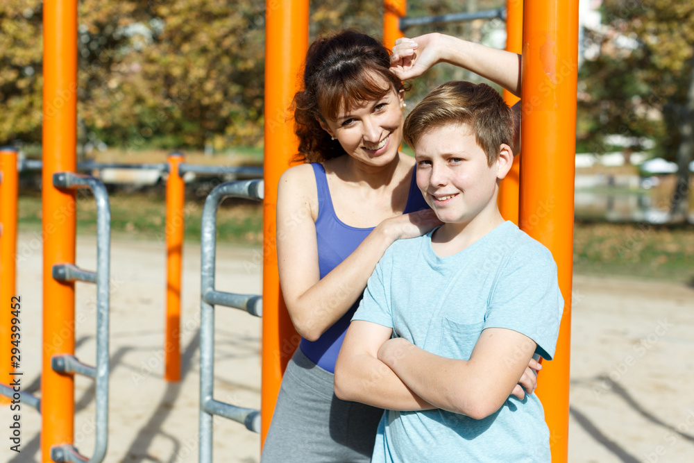 Fototapeta premium Sportive family at fitness station