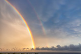 Stunning two big rainbows after the rain over the sea