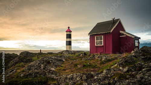  Lyngstuva lighthouse, at northernmost point of Lyngen peninsula during a vibrant summer sunset, Lyngen, Norway photo