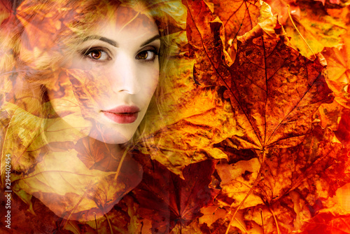 Art portrait of a woman in autumn dry leaves