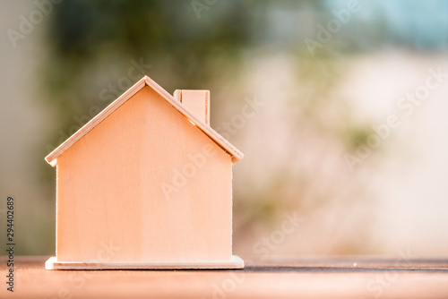 Miniature mockup house wood on wooden table. copy space