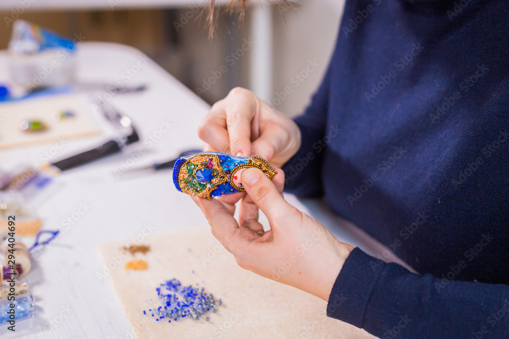 Designer making handmade brooch