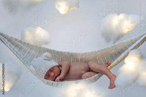 Canvas Print Cute little baby sleeping in the hammock