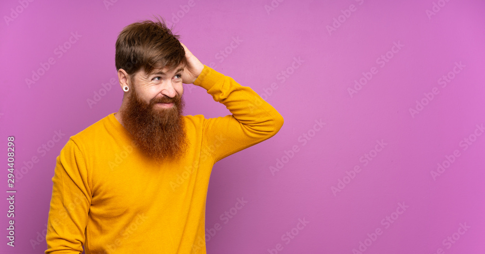 Redhead man with long beard over isolated purple background having doubts while scratching head Redhead man with long beard over isolated purple background having doubts while scratching head