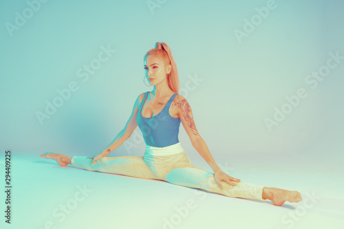 Athletic young woman doing yoga exercise