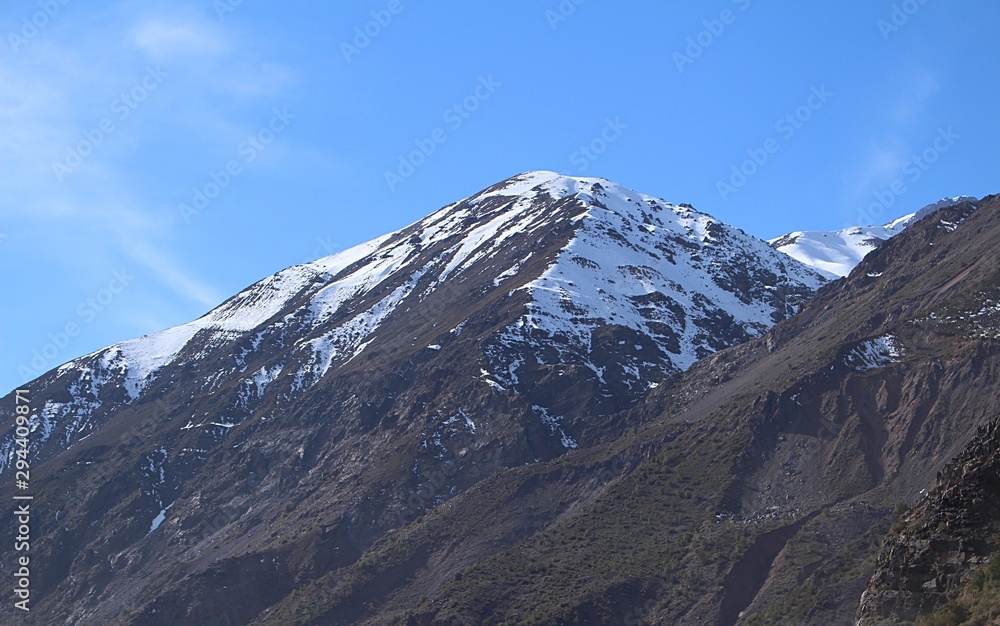 beautiful, big and high mountains with snowy on the top, in chilean andes mountain range.