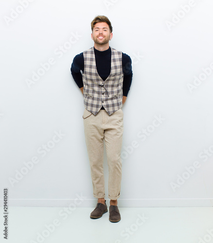 young man full body posing against white background photo