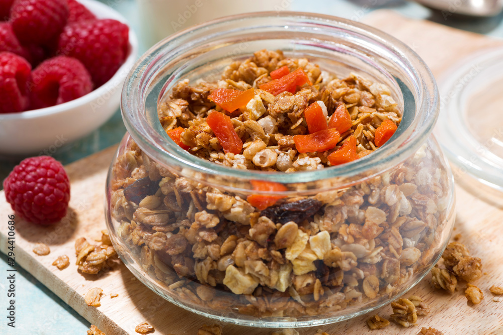 homemade granola with dried apricots and nuts, closeup homemade granola with dried apricots and nuts, closeup