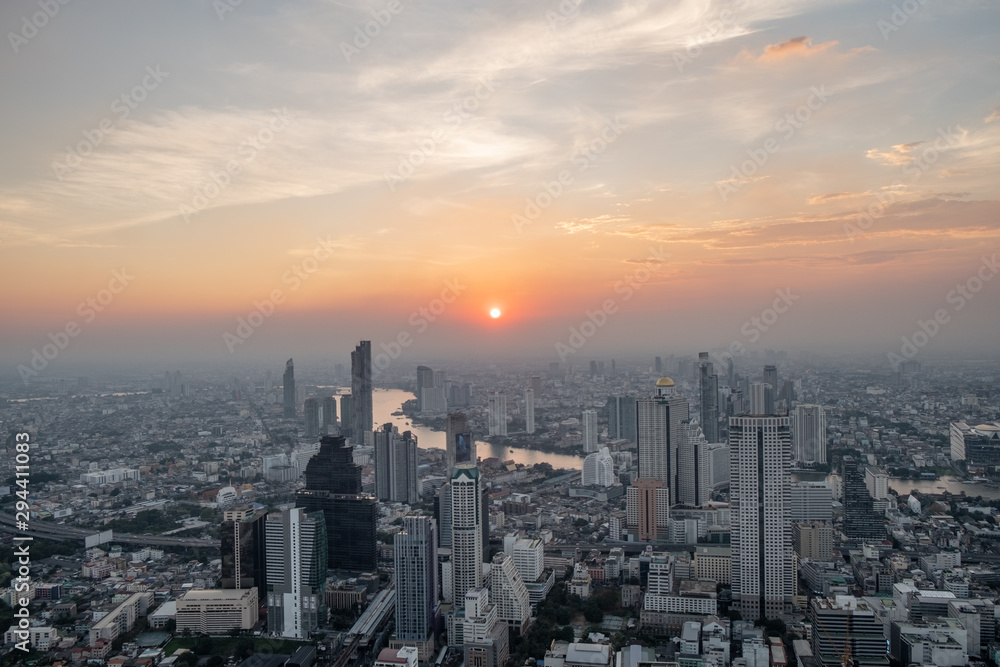 Bangkok cityscape at sunset. Urban sprawl with skyscrapers and hotels