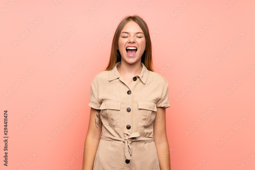 Lithuanian blonde girl over isolated pink background shouting to the front with mouth wide open Lithuanian blonde girl over isolated pink background shouting to the front with mouth wide open