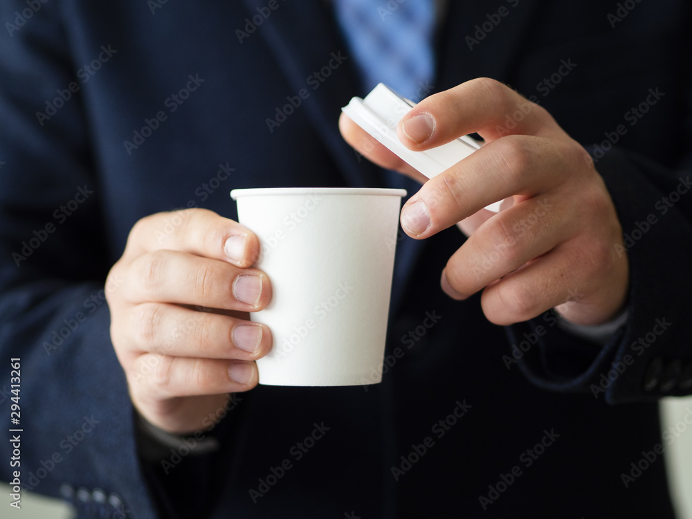 Man holding coffee cup mock-up Man holding coffee cup mock-up