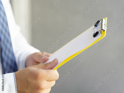 Side view man holding a clipboard mock-up