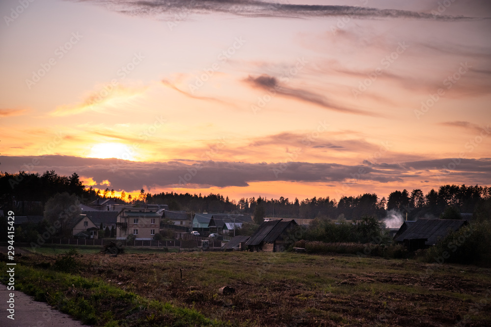 Natural Belarus village in light of sunset Natural Belarus village in light of sunset