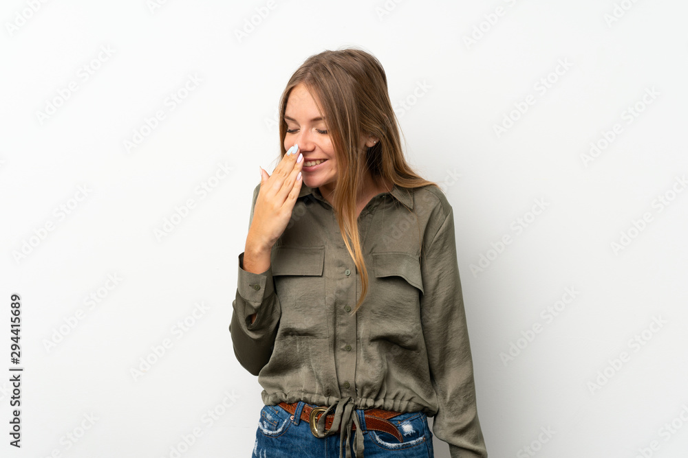 Fototapeta premium Lithuanian blonde girl over isolated white background smiling a lot