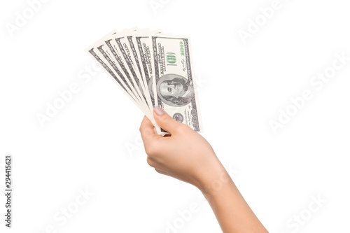 Woman hand holding pile of dollar bills