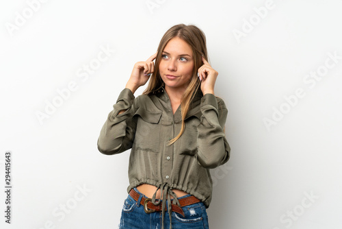 Lithuanian blonde girl over isolated white background having doubts and thinking