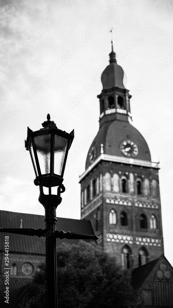 Photo of a street lamp with Dom church in Riga old town