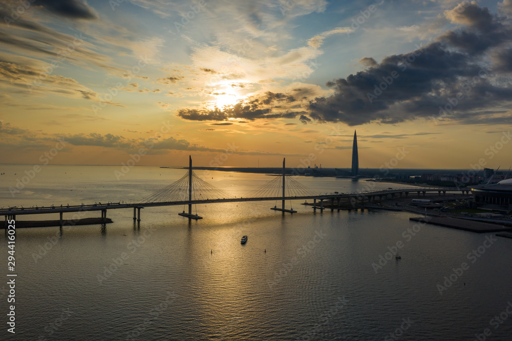 Sunset sky aerial view of cable-stayed bridge and new skyscraper in St.Petersburg during sunset