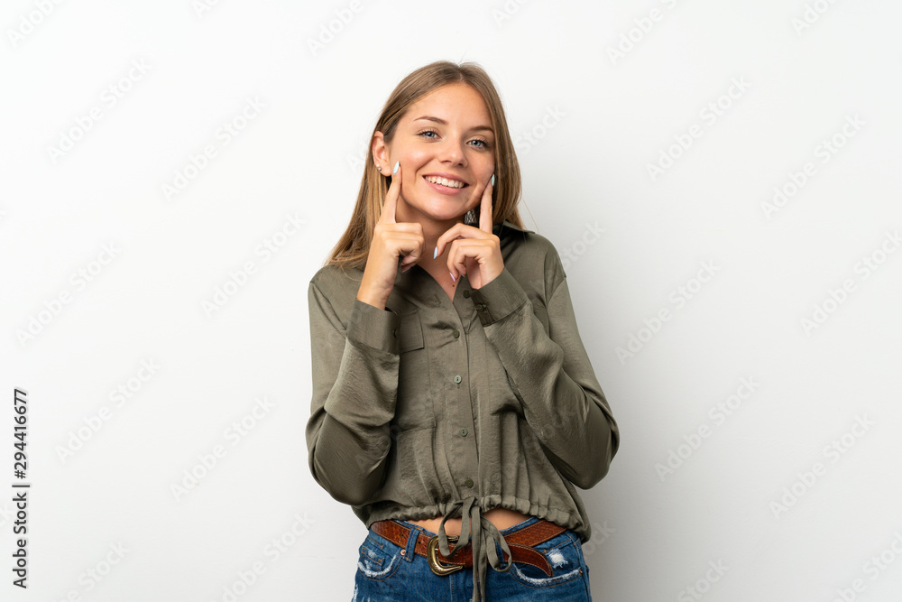 Lithuanian blonde girl over isolated white background smiling with a happy and pleasant expression Lithuanian blonde girl over isolated white background smiling with a happy and pleasant expression