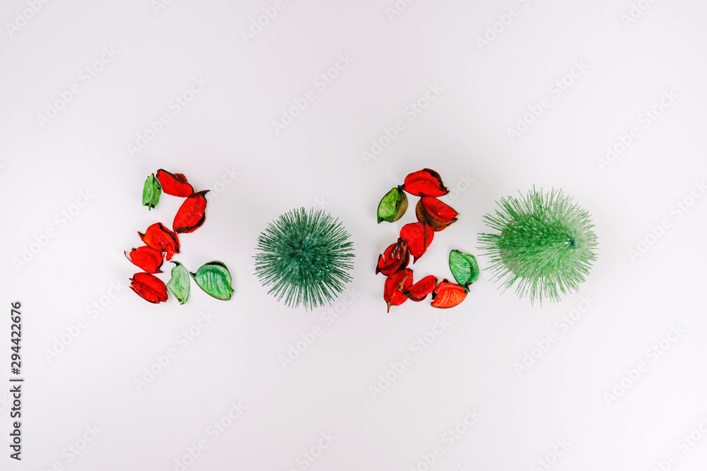 web banner minimal flat lay decorate for autumn to christmas and new year celebrate design from 2020 text from pine christmas tree and dry leaf on isolated white background