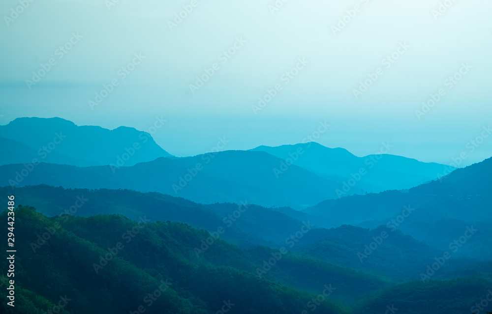 Beautiful landscape of Blue color mountain layer in morning sun ray and winter fog, Phetchabun, Thailand. Beautiful landscape of Blue color mountain layer in morning sun ray and winter fog, Phetchabun, Thailand.