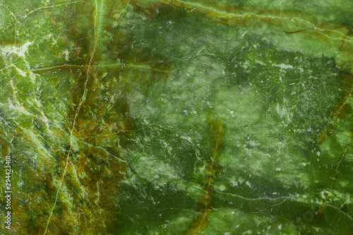 Green natural marble with brown veins in cracks, texture for ceramic tiles and floor tiles