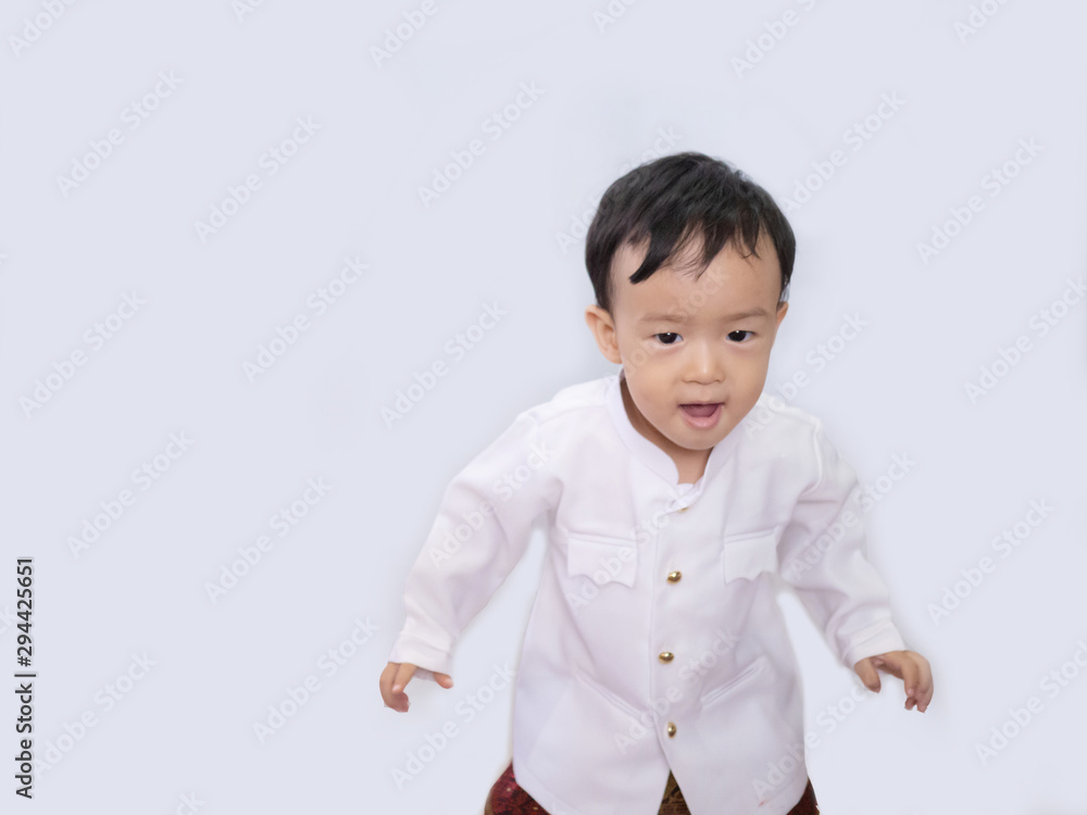 Thai little boy in traditional Thai costume in white background Thai little boy in traditional Thai costume in white background